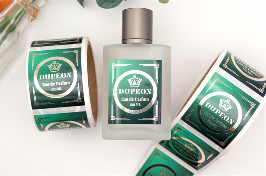 Foil product labels on square glass perfume bottle